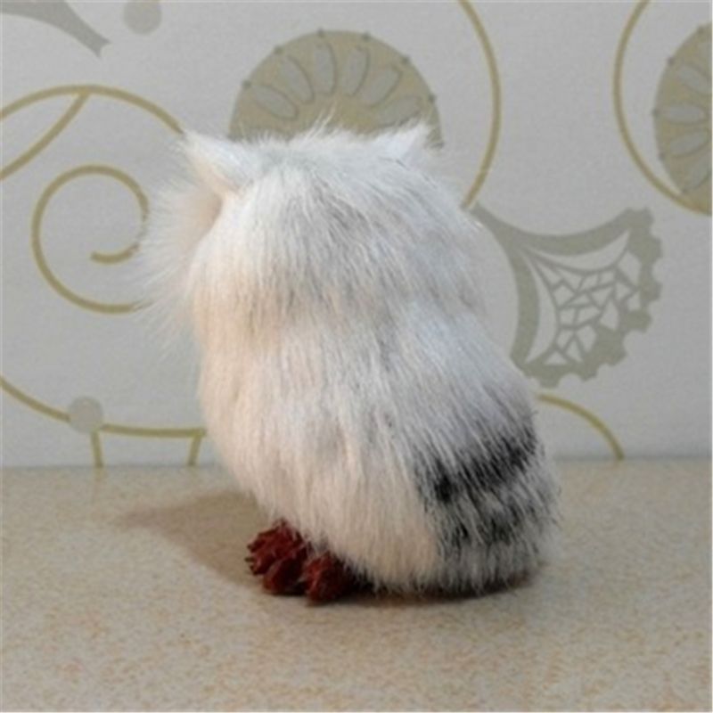 Hedwig owl toy plush doll shown from the back, featuring soft white fur and red feet, perfect for collectors.